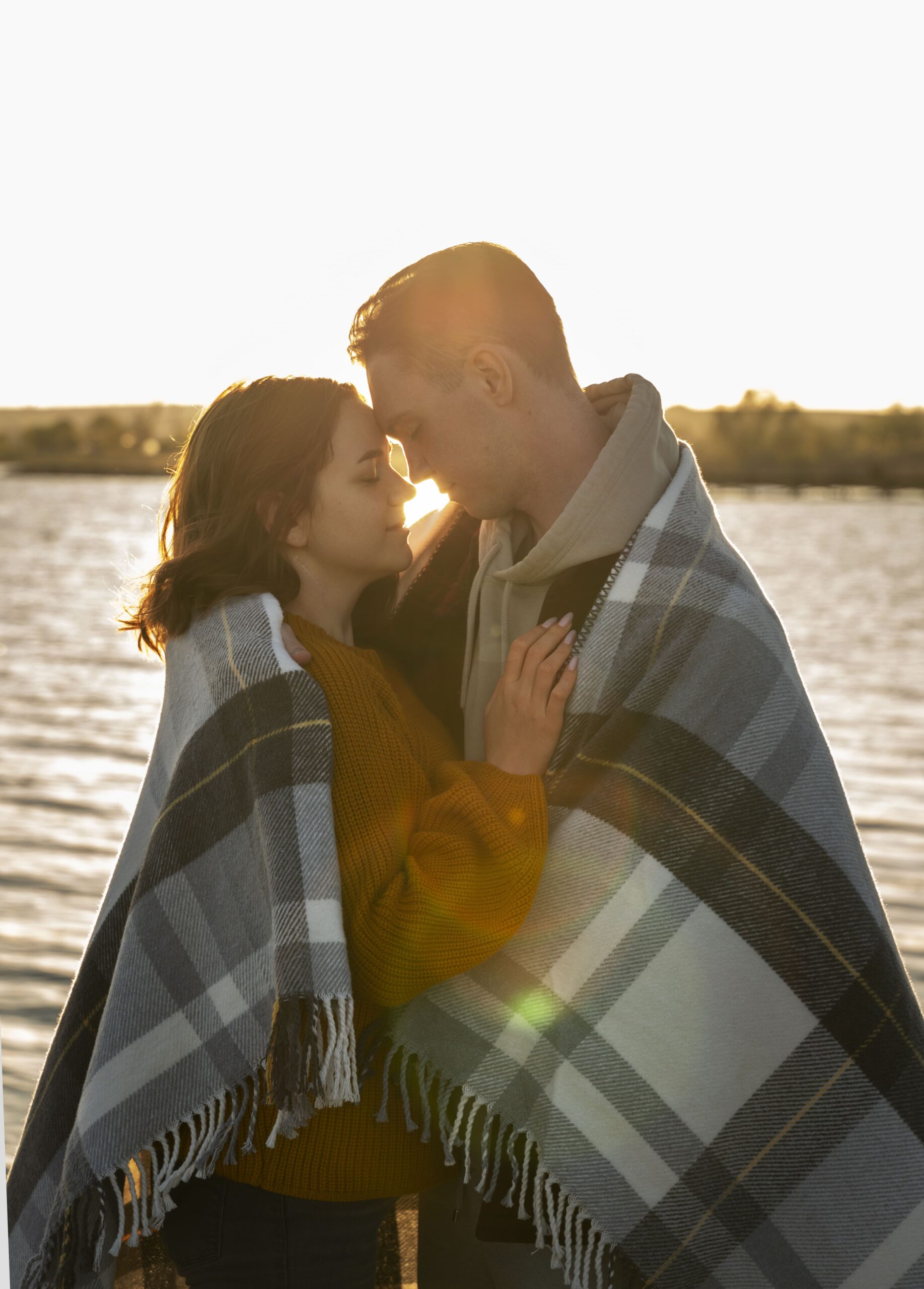couple-affectionate-attitude-wearing-plaid-blanket